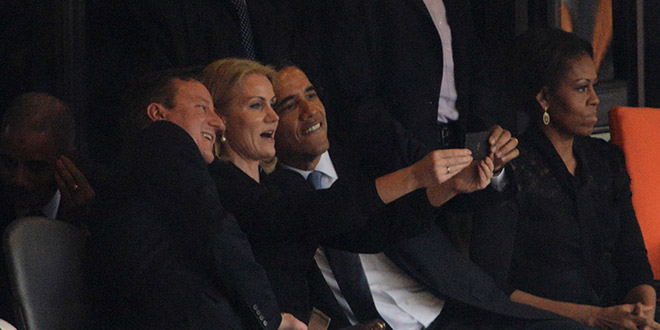 Obama self selfies President Barack Prime Minister David Cameron United Kingdom UK British Great Britain Helle Thorning-Schmidt Denmark Danish PM Nelson Mandela memorial service photoshop funeral Johannesburg South Africa African former Michelle First Lady wife self taking picture photograph pic themselves smiling snapping posing camera phone smartphone iphone narcissist narcissism death stadium world leaders media