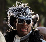 Dennis Rodman Diplomat to North Korea weird hat sunglasses piercings