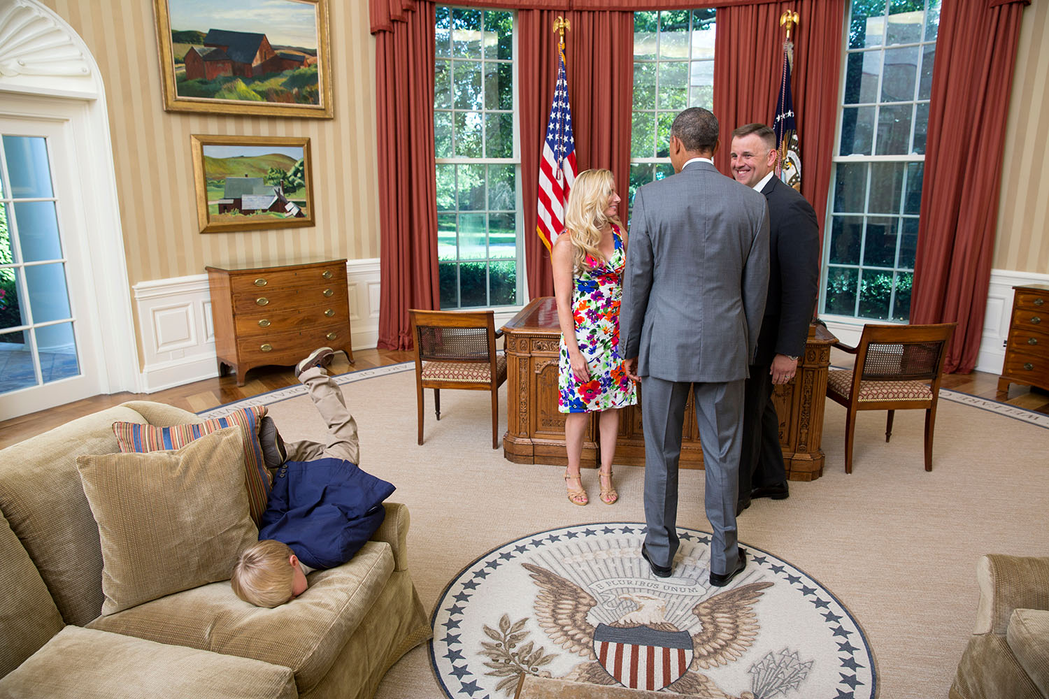 This Little Kid Does Not Care About Meeting President Obama This Little Kid Does Not Care About Meeting President Obama White House Flickr photograph photographer photo opp picture parents meeting Secret Service June 23, 2014 Mashable funny pic image face plant couch sofa plopped over head first Oval Office snapped uploaded most awesome kid ever child boy epitome of child-like boredom President Barack Obama visits with a departing United States Secret Service agent and his wife as their son dives