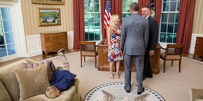 This Little Kid Does Not Care About Meeting President Obama White House Flickr photograph photographer photo opp picture parents meeting Secret Service June 23, 2014 Mashable funny pic image face plant couch sofa plopped over head first Oval Office snapped uploaded most awesome kid ever child boy epitome of child-like boredom